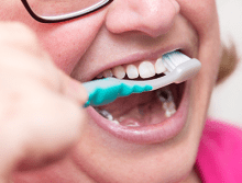 Person brushing teeth